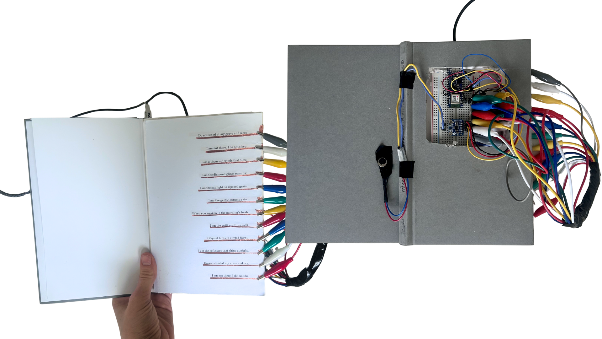 Poetry book front and back showing embedded haptic vibrator