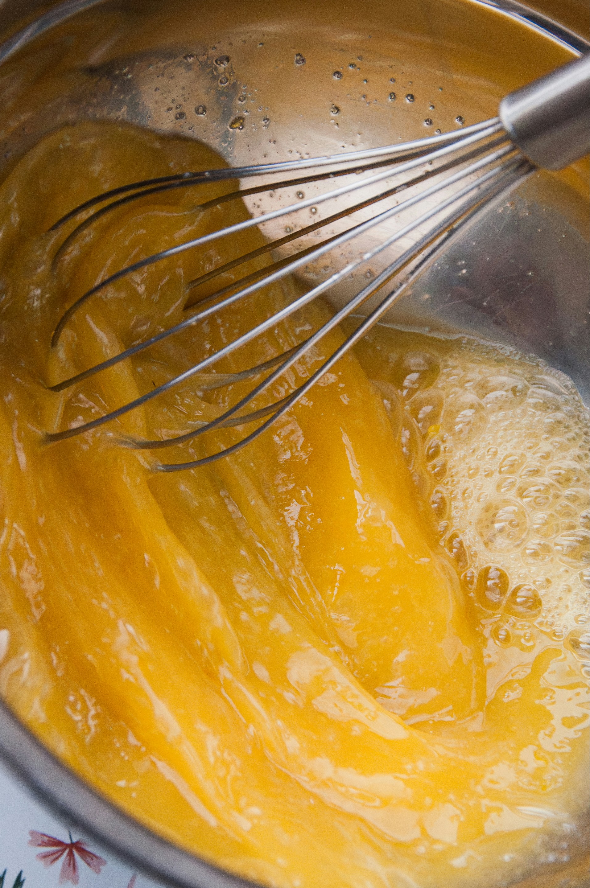 Egg whites being whisked, thickening over time