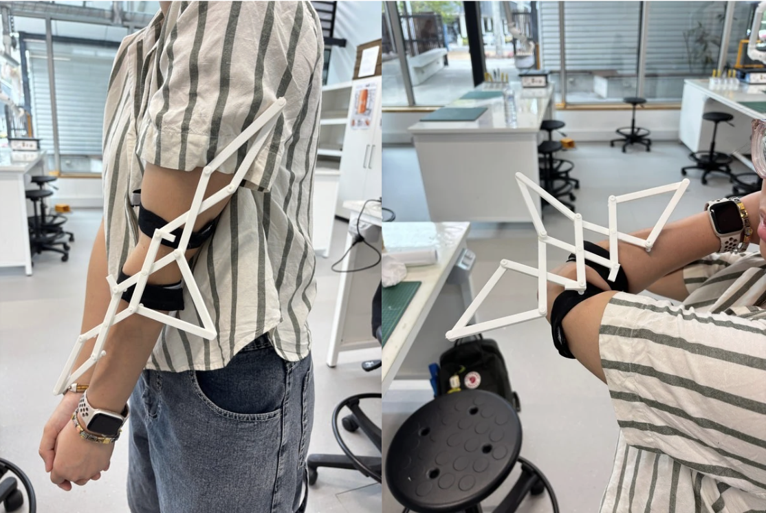 Skeletal sleeve prototype on arm, changing shape with movement